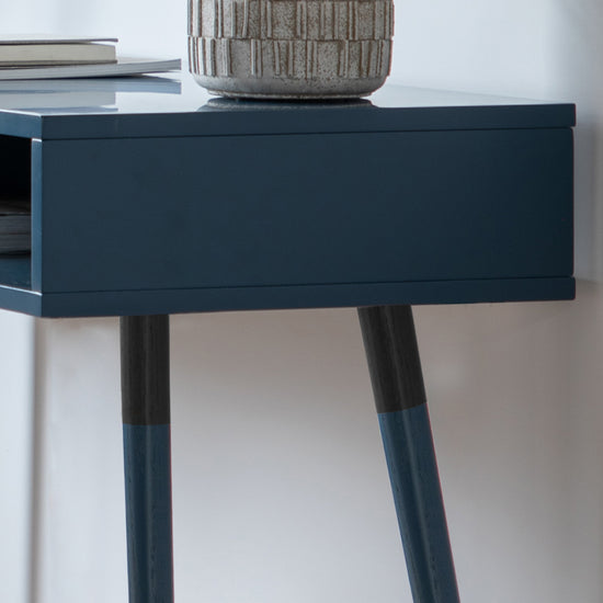 A Thurlestone Console Table Blue 1100x450x770mm providing home furniture and interior decor, with a vase on top.