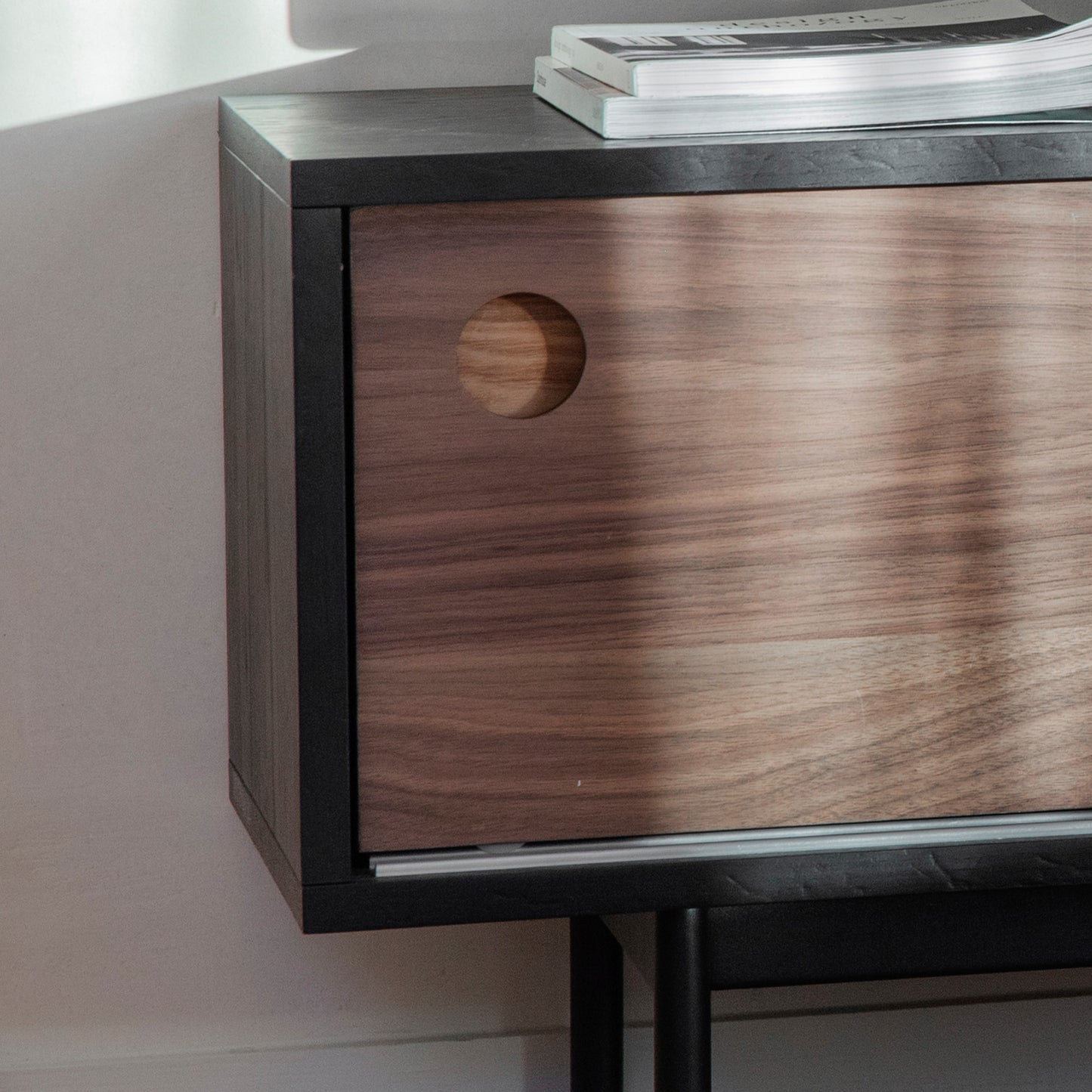 A Barbican Media Unit with a hole in the middle, perfect for interior decor and home furniture.