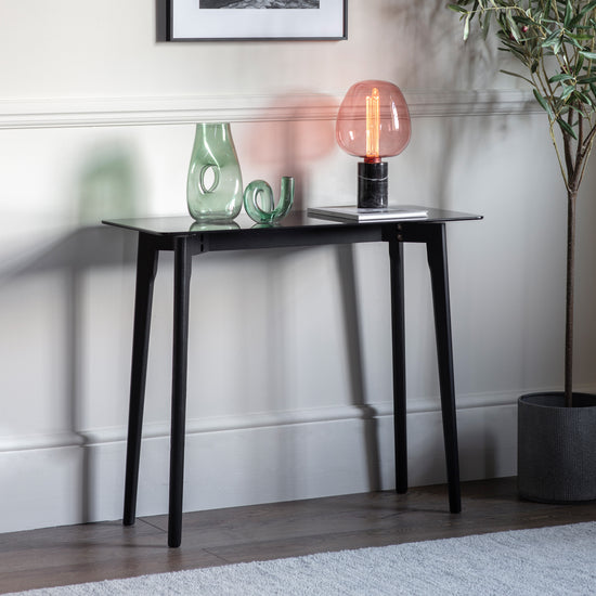 An Ashprington console table by Kikiathome.co.uk with a lamp, perfect for interior decor.