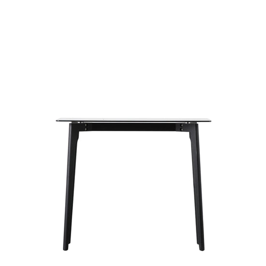 An Ashprington Console Table Black 900x380x750mm with a glass top, perfect for interior decor.