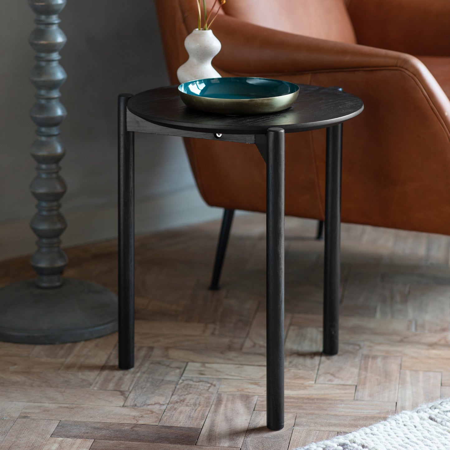 An Allington Side Table, a stylish piece of home furniture with a sleek black finish, perfect for interior decor.