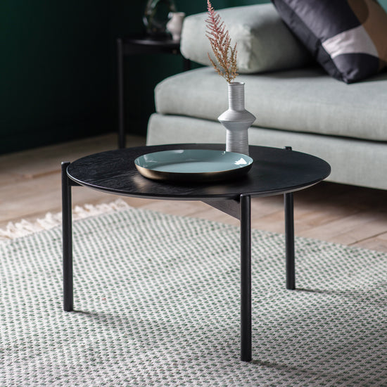 Load image into Gallery viewer, An Allington Coffee Table Black 700x700x400mm from Kikiathome.co.uk, enhancing interior decor with home furniture, placed in front of a green couch.
