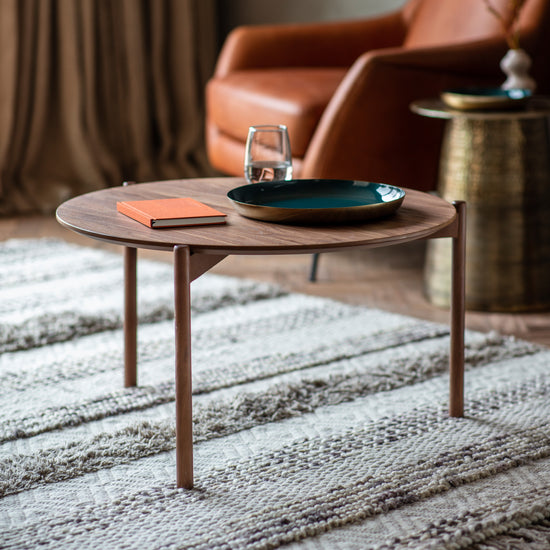 An Allington Coffee Table from Kikiathome.co.uk, a piece of home furniture, placed on a rug next to a chair.