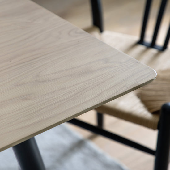 Load image into Gallery viewer, A close up of the Ashford Dining Table Oak 1600x900x750mm with a black chair from Kikiathome.co.uk, perfect for interior decor and home furniture.
