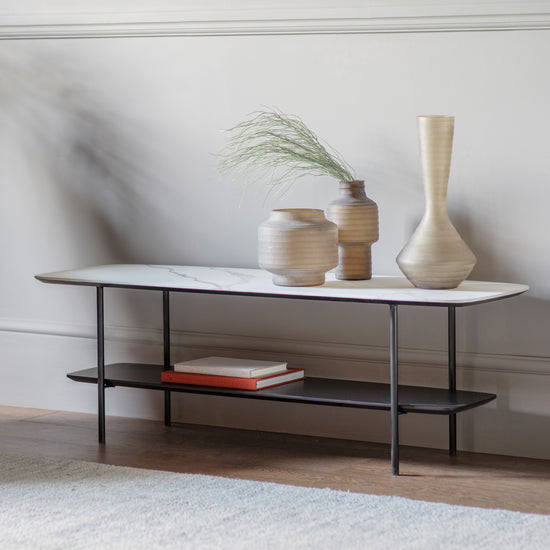 A Ludworth Coffee Table with a vase on top for home furniture and interior decor.