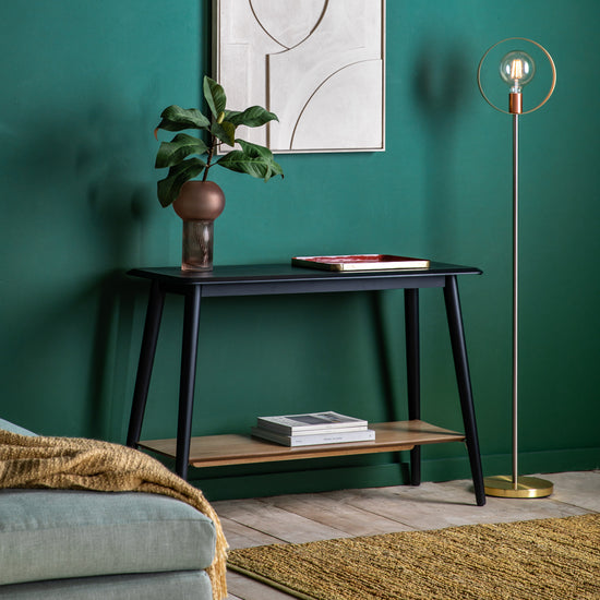 A living room with green walls and the Maddox Console Table with Shelf 110x750x40mm by Kikiathome.co.uk, enhancing interior decor through home furniture.