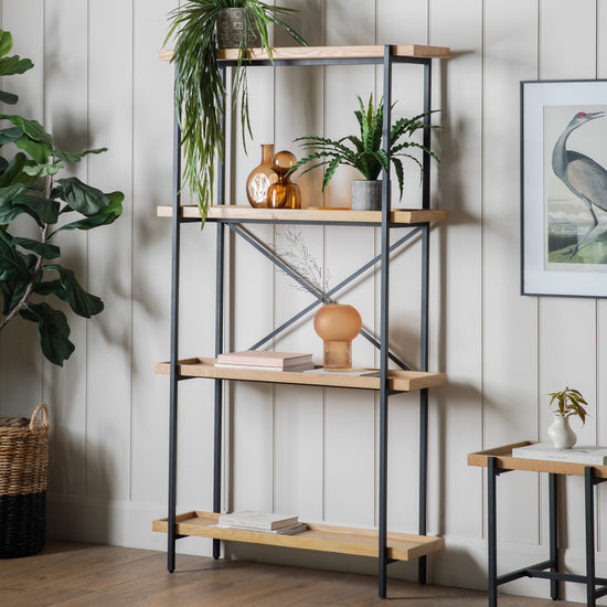 A large open display unit from Kikiathome.co.uk showcasing home furniture with a potted plant for interior decor.