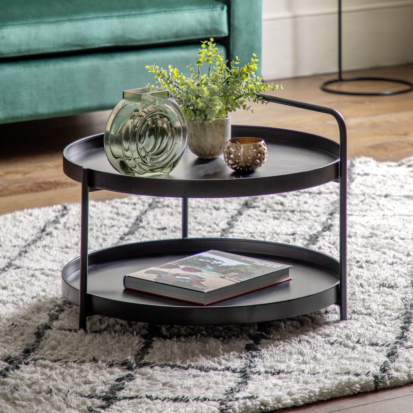 A Sennen Coffee Table Black 650x650x500mm by Kikiathome.co.uk enhances interior decor in a living room.