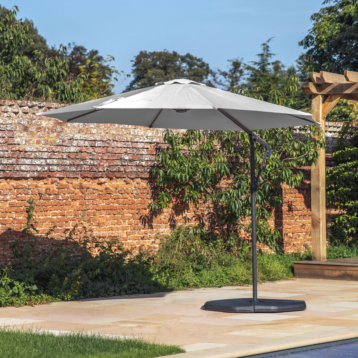 A white Alwington 3m Cantilever Parasol Grey for interior decor or home furniture on a brick patio from Kikiathome.co.uk.