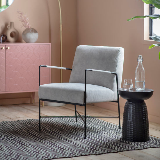 A room with a pink wall and stylish interior decor featuring the Kikiathome.co.uk Frogmore Armchair Grey.