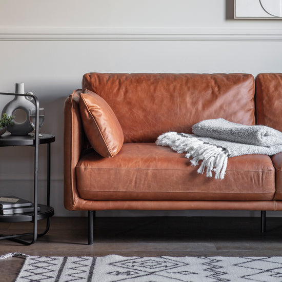 A Wigmore Sofa Brown Leather by Kikiathome.co.uk in a living room with interior decor.