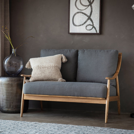 A Reliant 2 Seater Sofa Dark Grey Linen from Kikiathome.co.uk enhances interior decor.