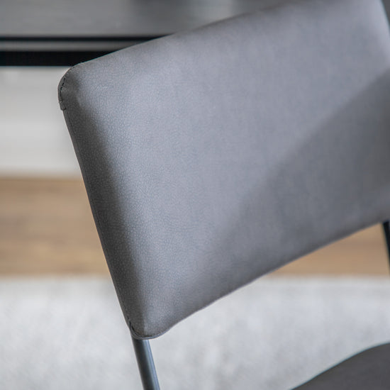 A close up of the back of a Chivelstone Dining Chair Charcoal (2pk) by Kikiathome.co.uk, suitable for home furniture and interior decor.