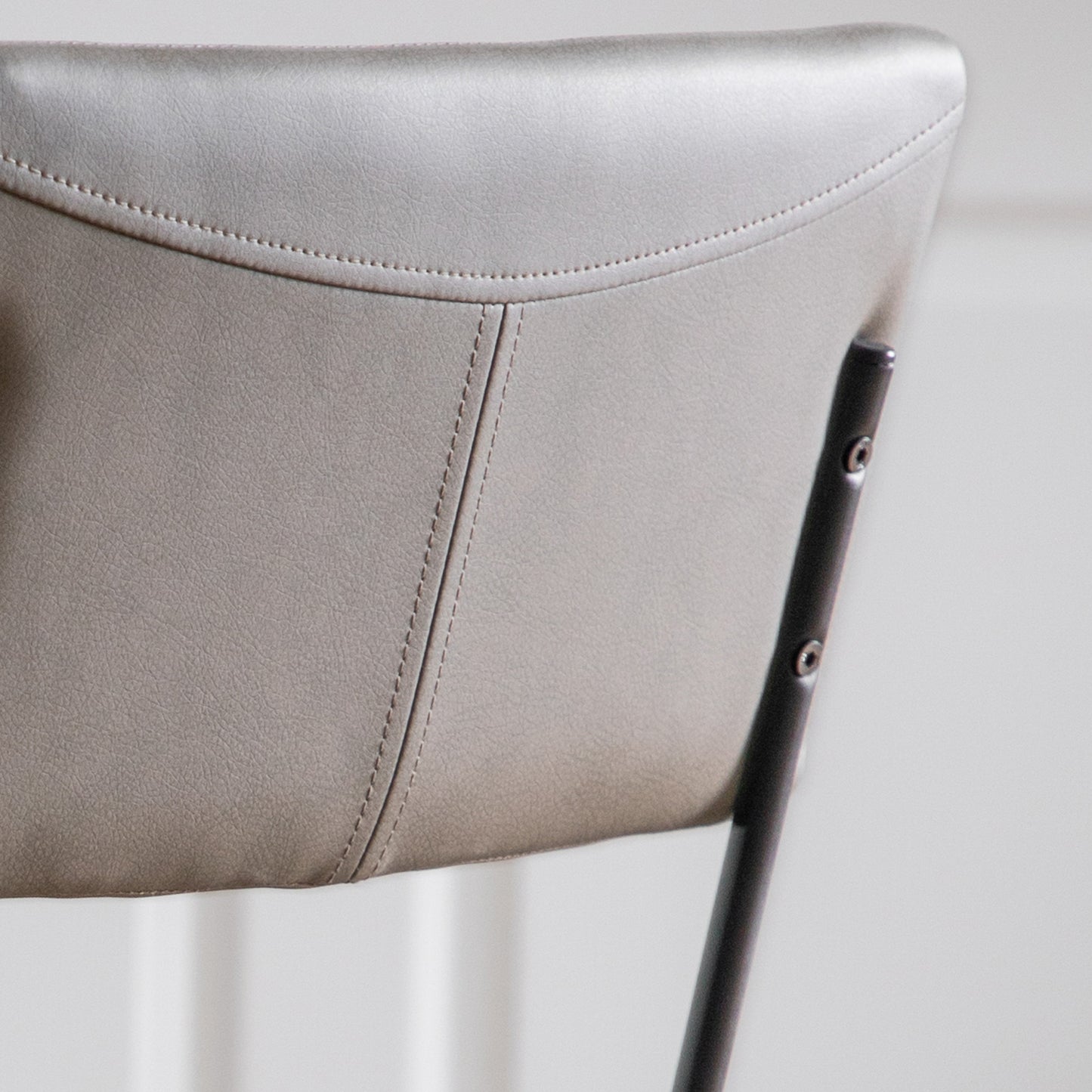 A close up of a Chivelstone Dining Chair Silver Grey (2pk) by Kikiathome.co.uk, perfect for interior decor and home furniture.