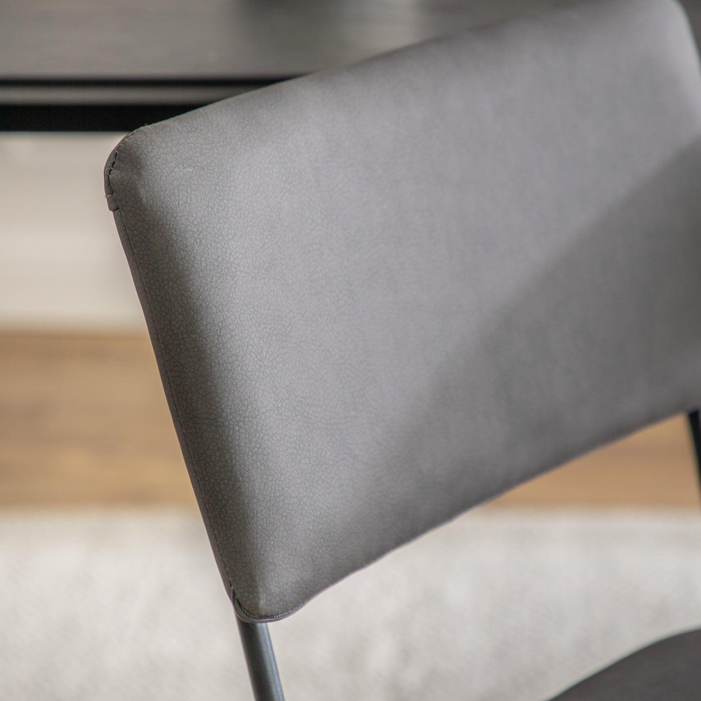 A close up of the back of a Chivelstone Dining Chair Slate Grey (2pk) for interior decor.