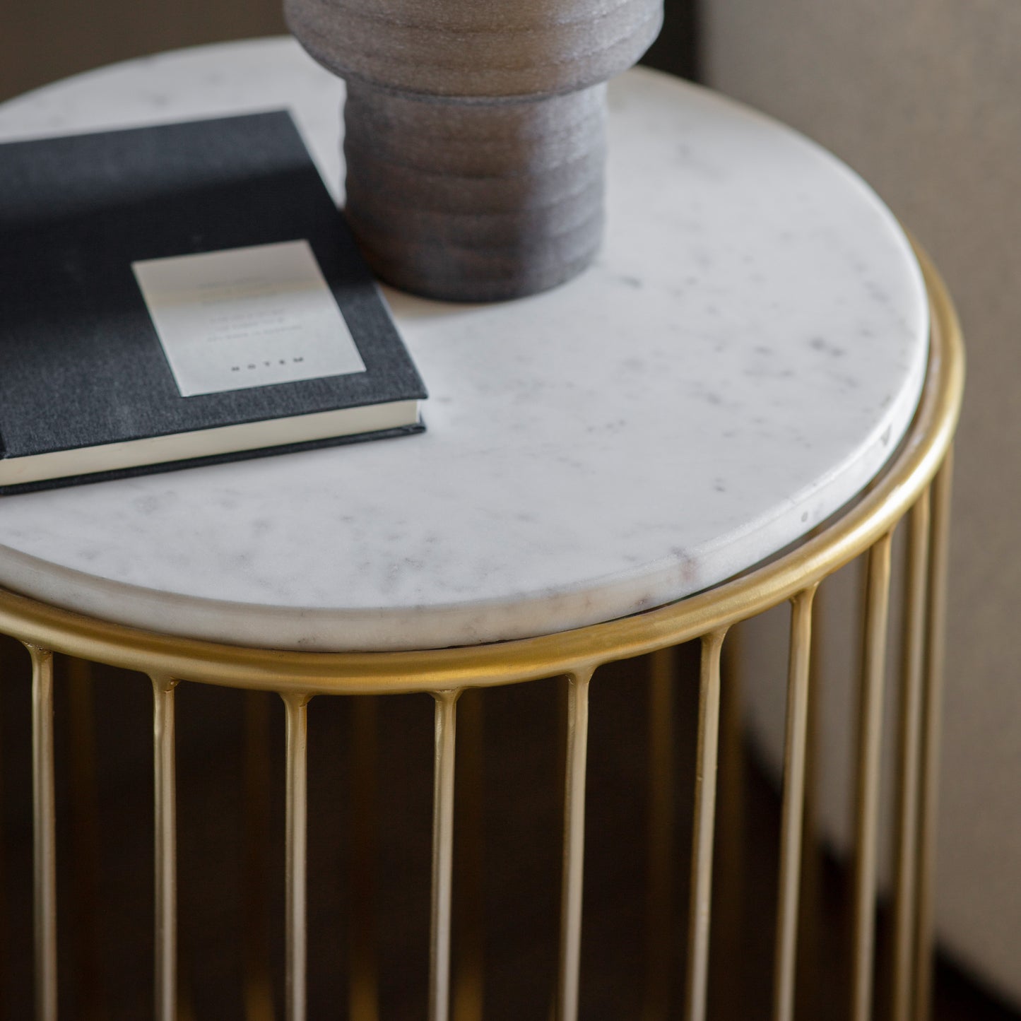 A Riley Side Table Gold with interior decor and home furniture.