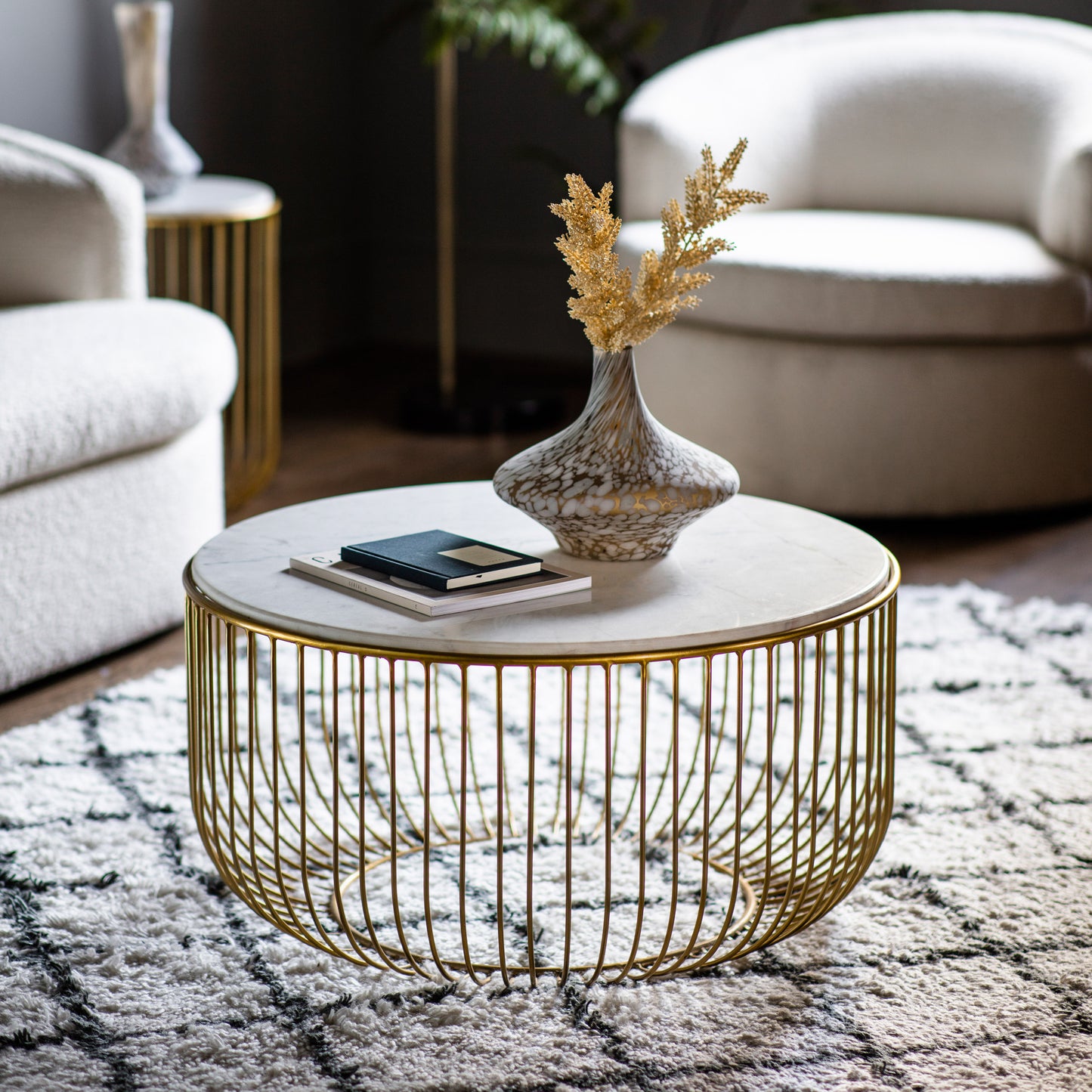A gold Riley coffee table by Kikiathome.co.uk enhancing the interior decor of a living room with home furniture.