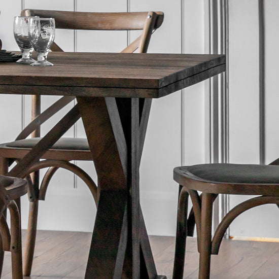 A Kikiathome.co.uk Ashbourne Dining Table Large with four chairs, perfect for interior decor and home furniture.