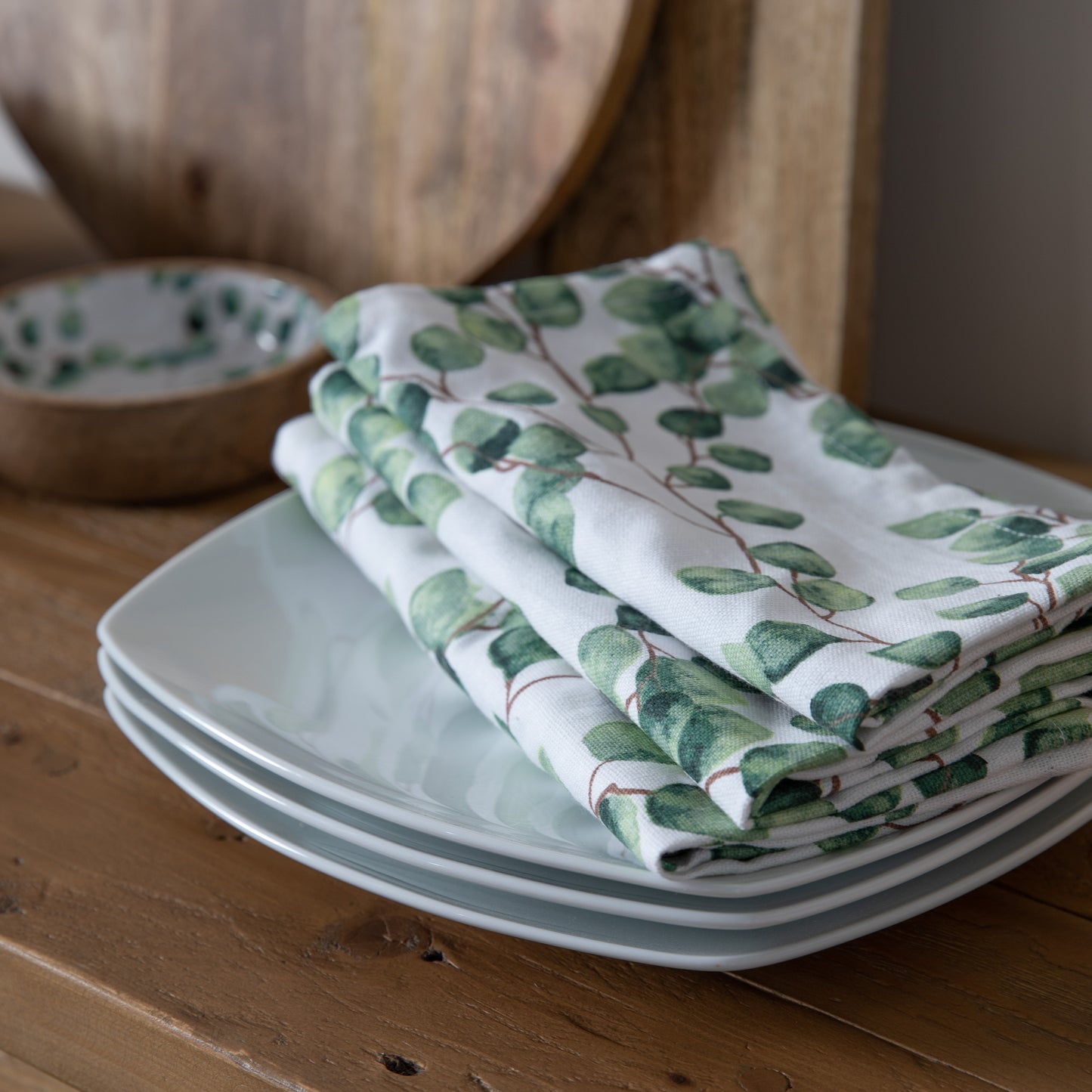 Load image into Gallery viewer, Kikiathome.co.uk Eucalyptus Napkin 450x450mm (4pk) on a wooden table for interior decor.
