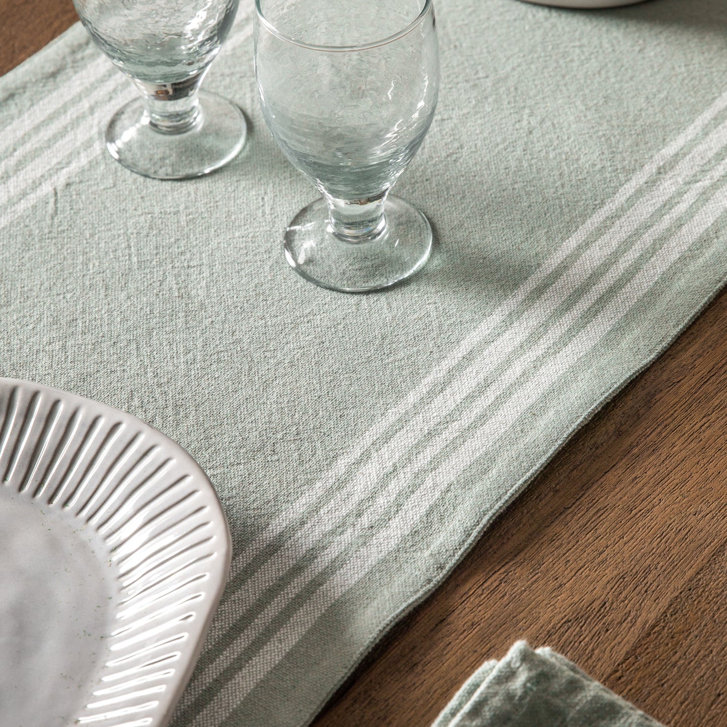 Load image into Gallery viewer, A stylish green stripe reversible table runner perfect for interior decor and home furniture.
