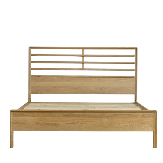 A Wembury 5' Bed frame with a slatted headboard for interior decor.