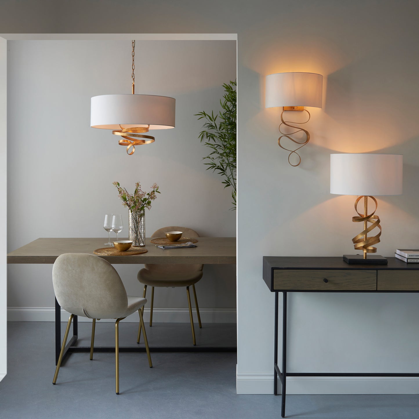 Load image into Gallery viewer, A dining room with two Kikiathome.co.uk Godfrey Table Light Golds and a table showcasing exquisite home furniture and interior decor.
