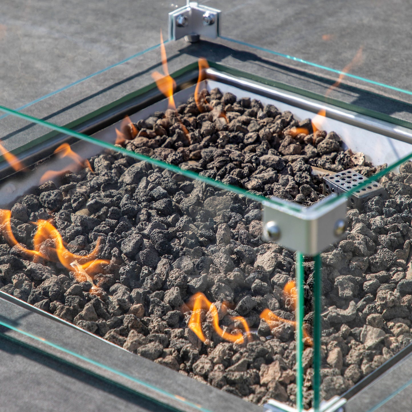 A Kikiathome.co.uk Dining Set combines home furniture and interior decor with a fire pit table slate featuring flames.