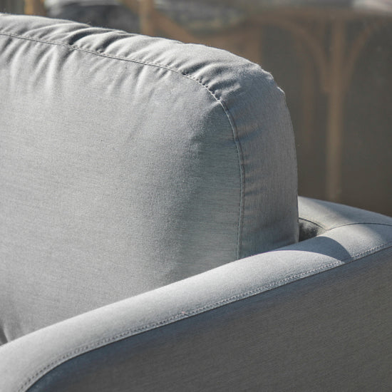 A close up of a Topsham Corner Lounge Set Slate couch with a cushion, perfect for interior decor and home furniture.