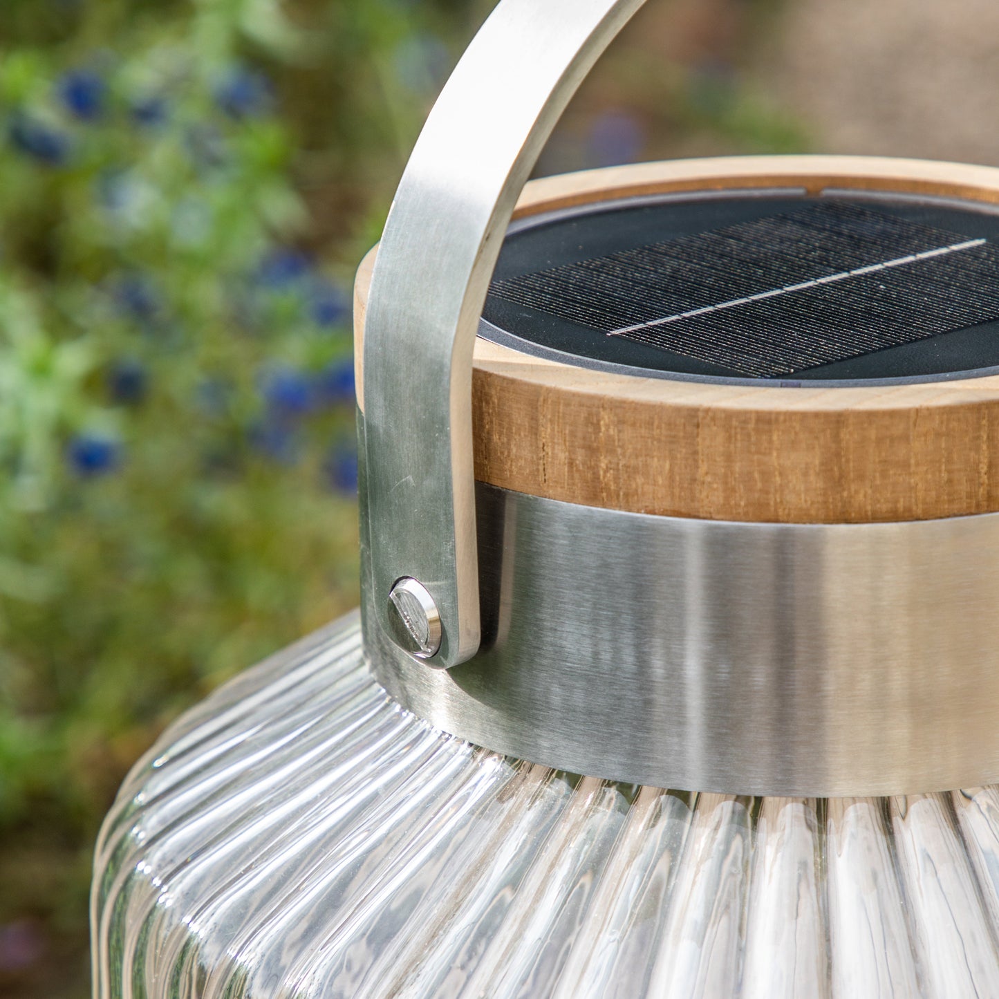 An Averton LED Solar Lantern Small with a wooden handle for interior decor.