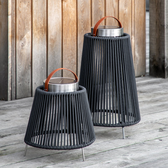Two Marldon LED Solar Lantern Large lanterns on a wooden deck, perfect for adding a touch of interior decor to your home.
