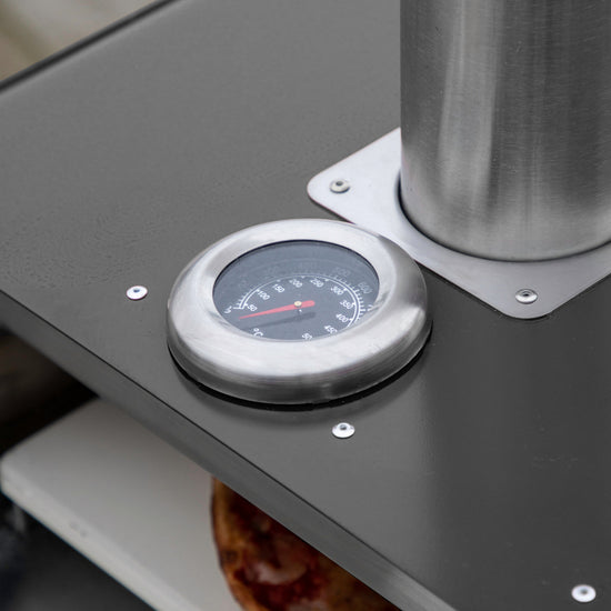 A Pellet Pizza Oven Black with a thermometer, ideal for interior decor and available on Kikiathome.co.uk.