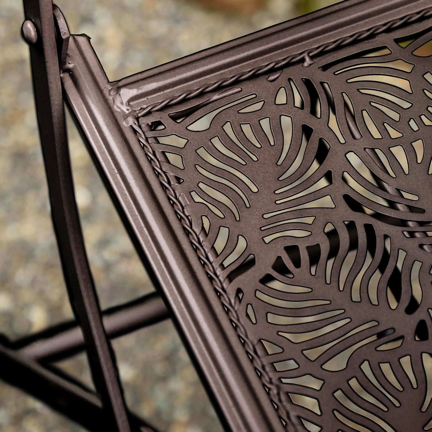 A close up of the Roborough 2 Seater Bistro Set with an interior decor pattern.