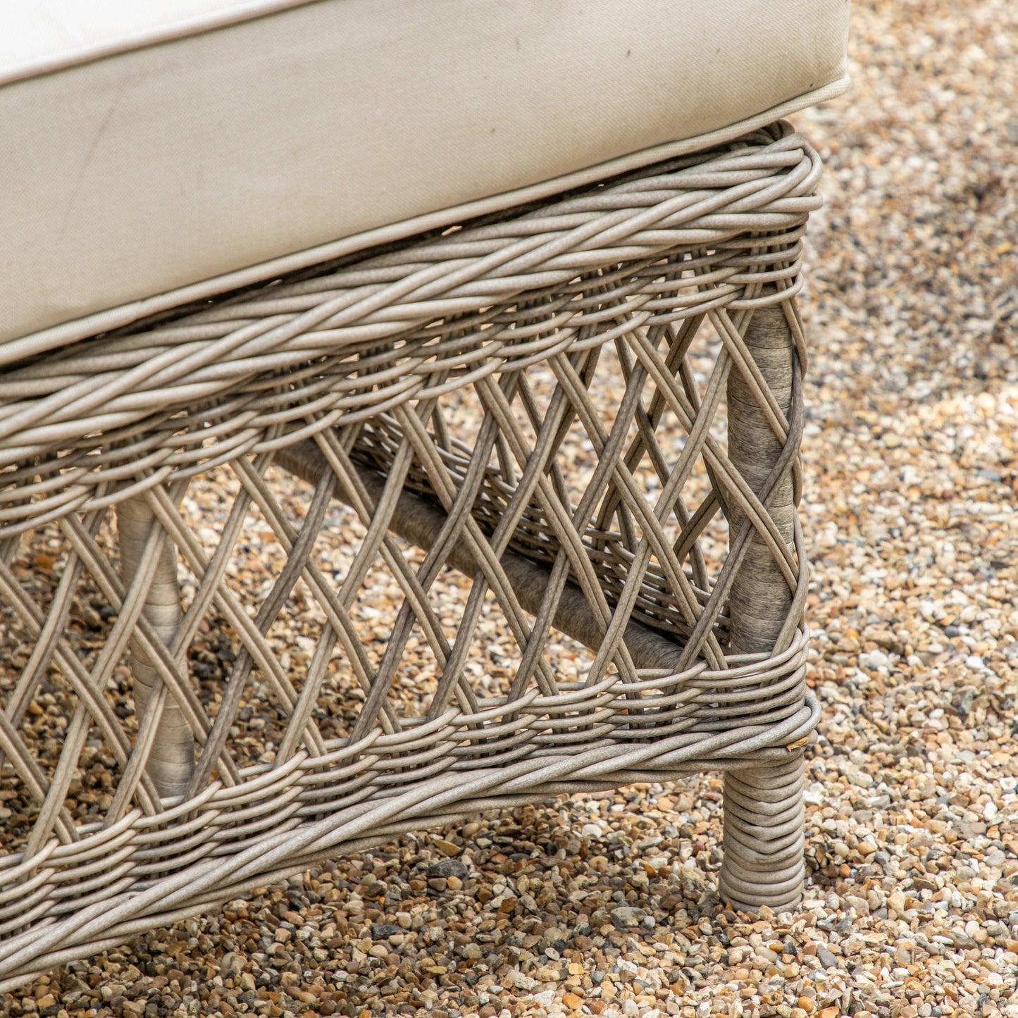A close up of the Allington Chaise Set Stone by Kikiathome.co.uk, a home furniture piece for interior decor, on gravel.