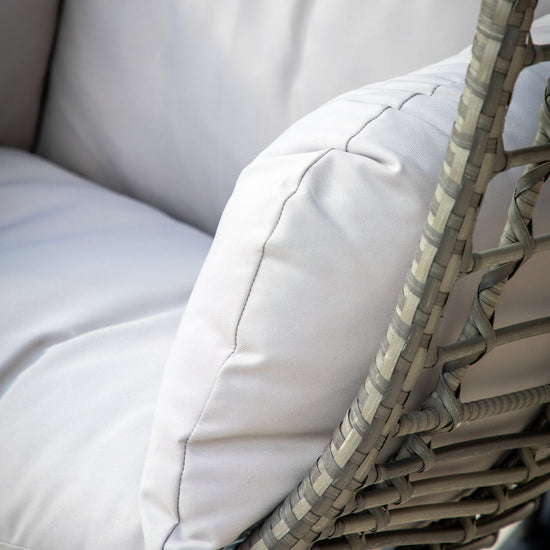 A close up of a white cushion on a stylish Woodleigh Hanging Chair for interior decor.