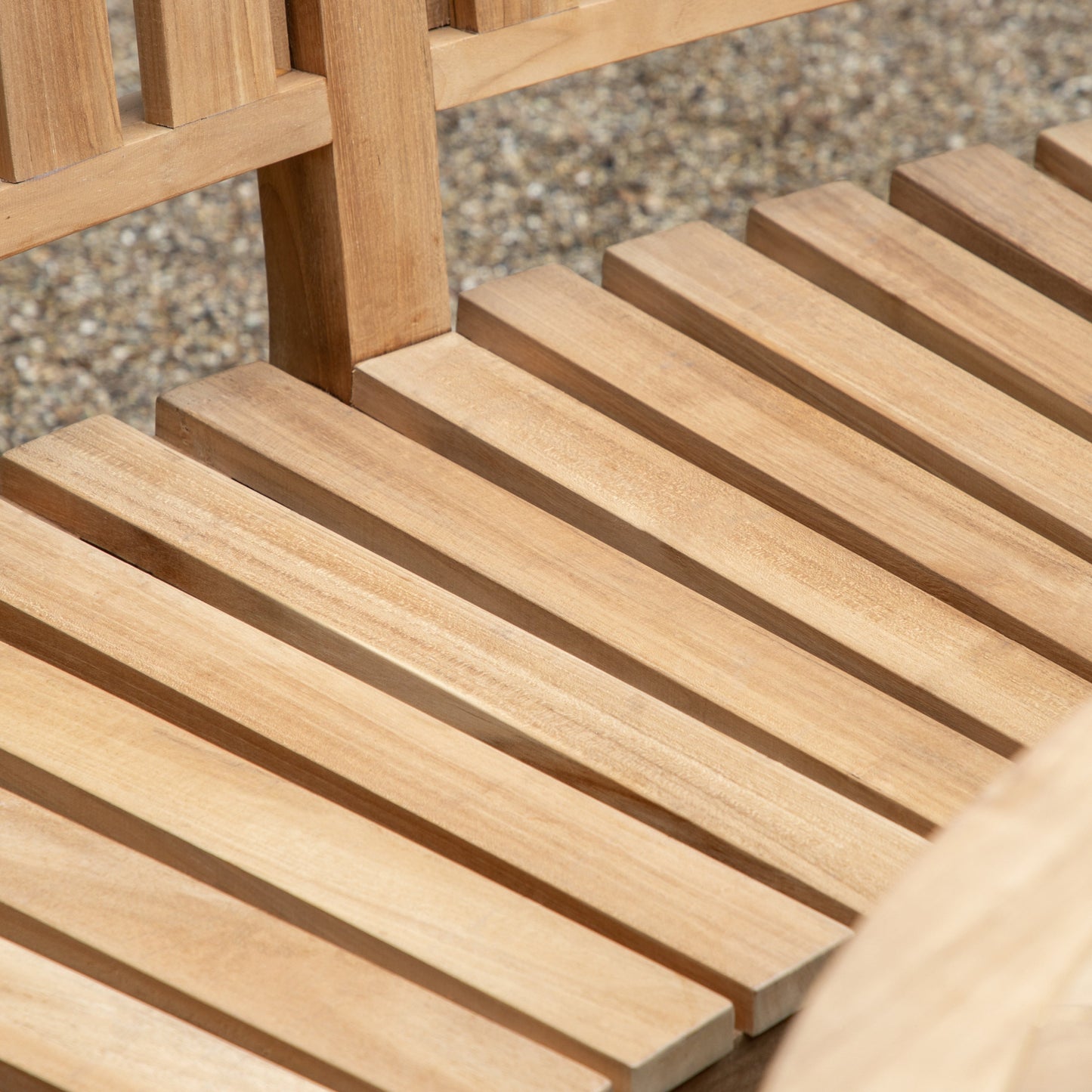 A close up of a Ottery Tall Back Bench 1540x745x1100mm with a table for interior decor.