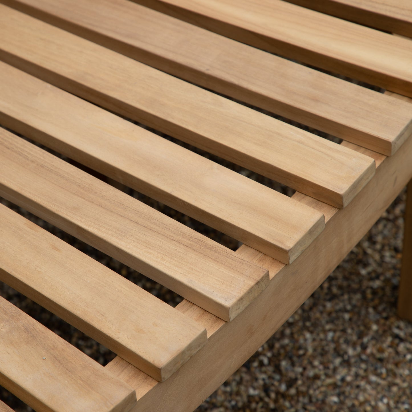 A stunning close up of the Ottery Bench with slats, perfect for home furniture and interior decor.